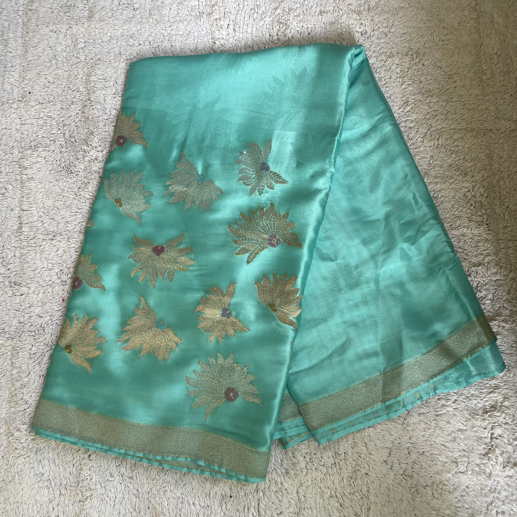 Sea Green Banarasi Satin Silk Saree With Golden And Silver Floral Weaved