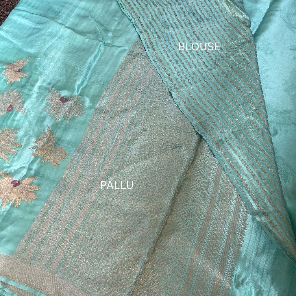 Sea Green Banarasi Satin Silk Saree With Golden And Silver Floral Weaved